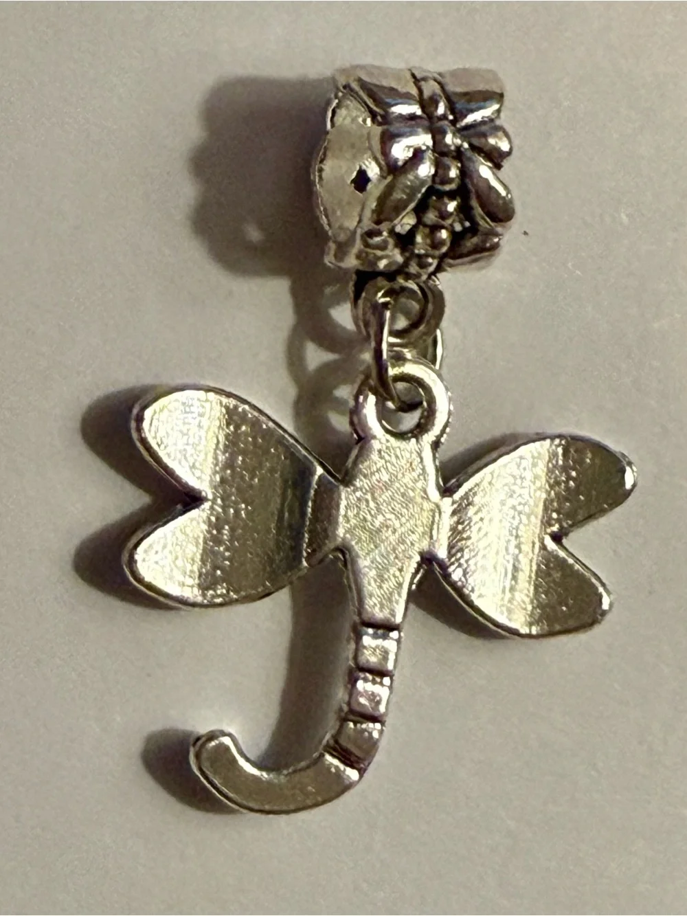 Charm / pendant - dragonfly charm w/butterfly on bail - silver tone. New!
